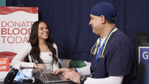 Blood donor asking questions about the donation process with a CBC doctor.